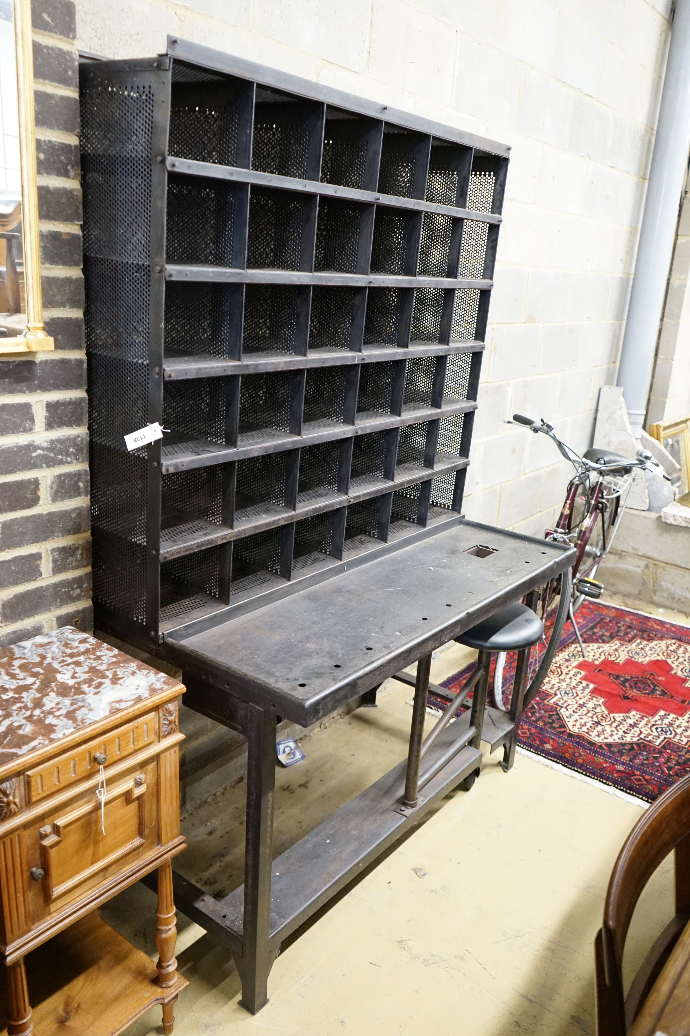 A Royal Mail metal mail sorting unit with integral seat, width 127cm, depth 71cm, height 190cm
